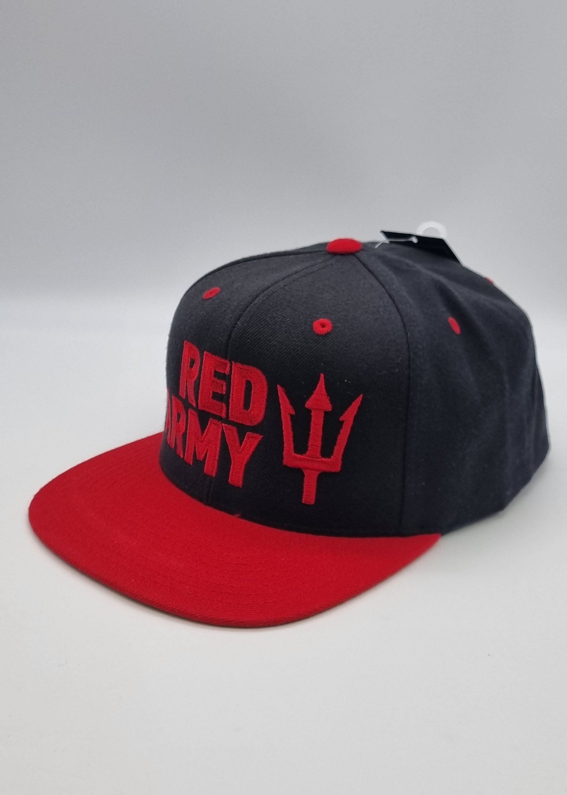 Black and red cap with visible branding on a black background